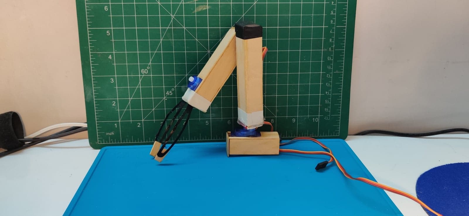 The arm on the bench, claw lowered