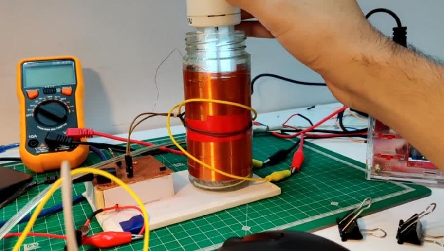 The Slayer exciter lighting a bulb held above the coil, with nothing connected to it